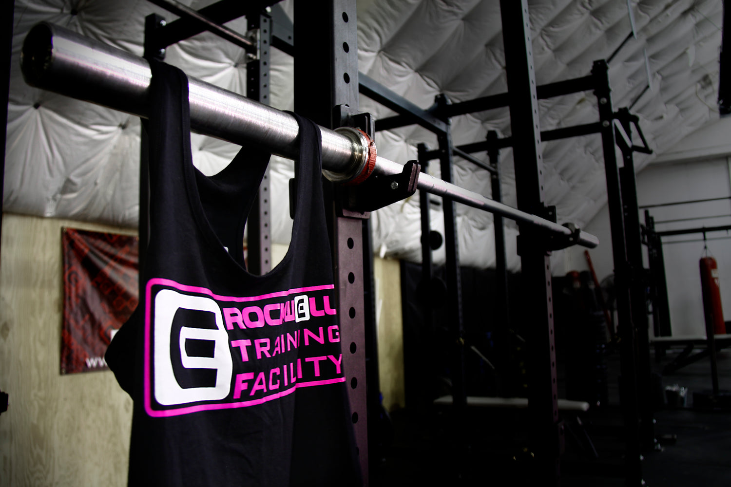 Rockwell Training Facility tank top on barbell 